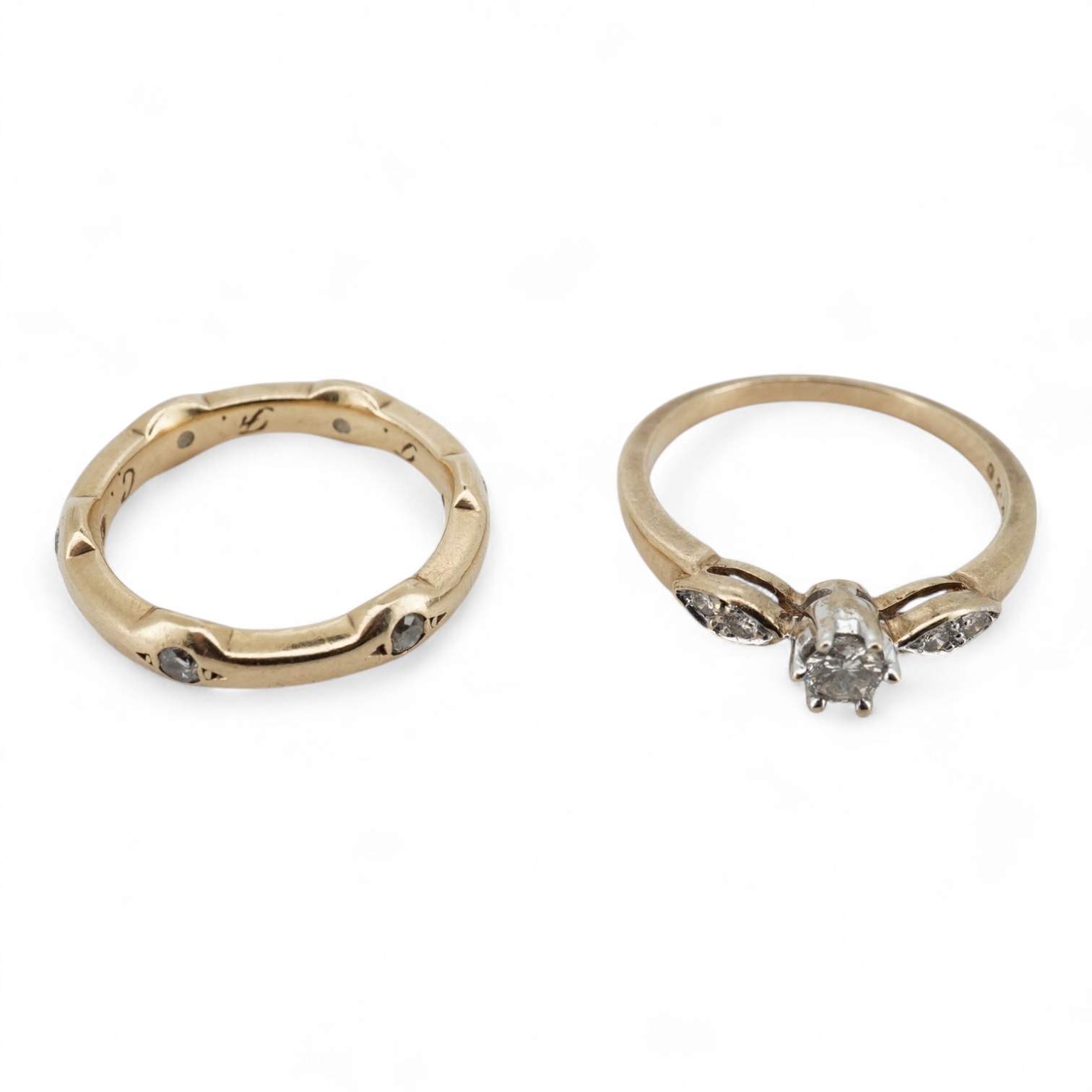 A modern 9ct gold and claw set single stone diamond ring, with four stone diamond chip set shoulders, size N, total carat weight approximately 0.20ct and a similar 9ct gold and six stone diamond set band, size K, gross w